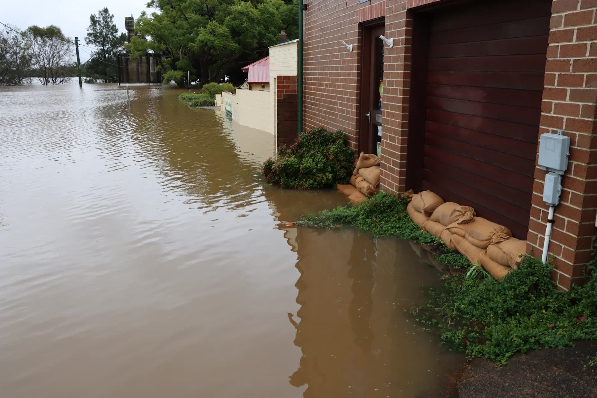 Industrial water extraction equipment on flooded hardwood floor